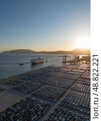 New Cars on Parking Lot and RORO cargo ship in Port of Setubal. Aerial View. Стоковое фото, фотограф Максим Забаровский / Фотобанк Лори