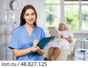 Young doctor with folder. Стоковое фото, фотограф Яков Филимонов / Фотобанк Лори
