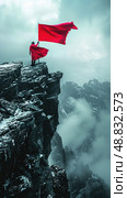A person stands on the edge of a rocky cliff, holding a red flag that billows in the wind. The cliff drops off into a misty valley below. Стоковое AI-изображение, AI-художник Данила Большаков / Фотобанк Лори