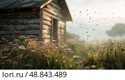 Bees Pollinate Vibrant Flowers Near a Rustic Wooden Cabin in a Sunny Meadow. Стоковое AI-изображение, AI-художник Юлия Гапеенко / Фотобанк Лори