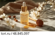 Bottle of golden oil with honey and almonds surrounded by flowers on marble. Бутылка золотого масла с медом и миндалем в окружении цветов на мраморе. Стоковое AI-изображение, AI-художник Katsiaryna Repich / Фотобанк Лори