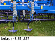 Agricultural machinery close-up with metal components and red frame. Стоковое фото, фотограф Вербицкая Светлана / Фотобанк Лори