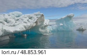 Big Iceberg in Antarctica Winter Scenery, Amazing Shape Ice Formation of Massive Large Enormous Blue Icebergs in Antarctic Peninsula Landscape Seascape with Ocean Sea Water. Стоковое видео, видеограф Vladimir / Фотобанк Лори