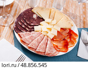 Slicing of smoked sausage, ham, dried pork carbonade and cheese. Стоковое фото, фотограф Яков Филимонов / Фотобанк Лори