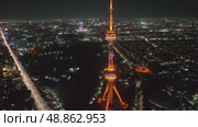 A drone over the city at night flies around a TV tower illuminated by lights. Cloudless Summer Night. Стоковое видео, видеограф Aleksey Kidisyuk / Фотобанк Лори