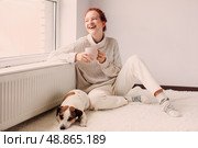 Young Woman Drinking hot coffee at white room. Стоковое фото, фотограф Гладских Татьяна / Фотобанк Лори