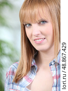Portrait of a woman in a checked shirt. Стоковое фото, агентство Ingram Publishing / Фотобанк Лори