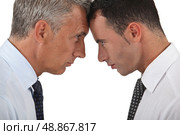 Men head butting. Стоковое фото, агентство Ingram Publishing / Фотобанк Лори