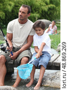 Man out fishing with his son. Стоковое фото, агентство Ingram Publishing / Фотобанк Лори