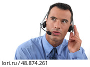Man speaking into a hands-free headset. Стоковое фото, агентство Ingram Publishing / Фотобанк Лори