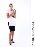 Full length studio shot of a waitress with menu and order pad. Стоковое фото, агентство Ingram Publishing / Фотобанк Лори