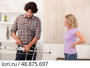 a man repairing a TV roof antenna. Стоковое фото, агентство Ingram Publishing / Фотобанк Лори