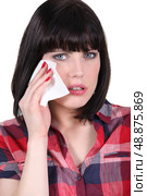 Woman wiping away a tear. Стоковое фото, агентство Ingram Publishing / Фотобанк Лори