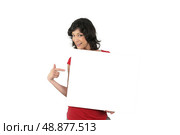 Enthusiastic woman pointing to a blank sign. Стоковое фото, агентство Ingram Publishing / Фотобанк Лори