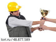 craftsmen fighting for a golden cup. Стоковое фото, агентство Ingram Publishing / Фотобанк Лори