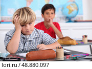 Child in school bored. Стоковое фото, агентство Ingram Publishing / Фотобанк Лори