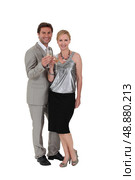 Studio shot of a couple drinking champagne. Стоковое фото, агентство Ingram Publishing / Фотобанк Лори