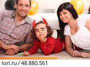 Little girl dressed as devil. Стоковое фото, агентство Ingram Publishing / Фотобанк Лори