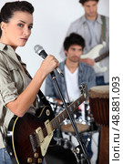 A band jamming together. Стоковое фото, агентство Ingram Publishing / Фотобанк Лори