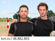 two serious football players. Стоковое фото, агентство Ingram Publishing / Фотобанк Лори