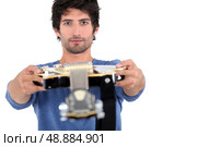 man holding guitar. Стоковое фото, агентство Ingram Publishing / Фотобанк Лори