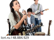Female vocalist in a band. Стоковое фото, агентство Ingram Publishing / Фотобанк Лори