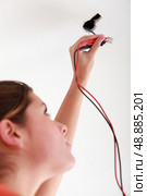 Women splicing wires. Стоковое фото, агентство Ingram Publishing / Фотобанк Лори