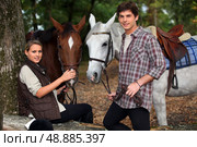 young boy and girl riding horses. Стоковое фото, агентство Ingram Publishing / Фотобанк Лори