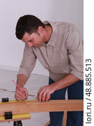 handyman with lead pencil. Стоковое фото, агентство Ingram Publishing / Фотобанк Лори