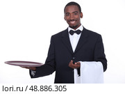 well dressed black waiter. Стоковое фото, агентство Ingram Publishing / Фотобанк Лори
