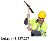 Angry construction worker holding a pickaxe. Стоковое фото, агентство Ingram Publishing / Фотобанк Лори