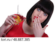 Surprised woman eating fruit salad. Стоковое фото, агентство Ingram Publishing / Фотобанк Лори