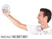 Man holding at symbol. Стоковое фото, агентство Ingram Publishing / Фотобанк Лори