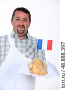 butcher with certified chicken. Стоковое фото, агентство Ingram Publishing / Фотобанк Лори