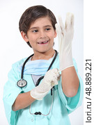 Kid dressed as surgeon. Стоковое фото, агентство Ingram Publishing / Фотобанк Лори