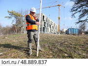 surveyor on a construction site. Стоковое фото, агентство Ingram Publishing / Фотобанк Лори