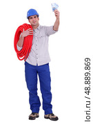 Plumber with a fistful of Euros. Стоковое фото, агентство Ingram Publishing / Фотобанк Лори