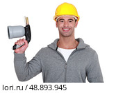 Man holding blowtorch. Стоковое фото, агентство Ingram Publishing / Фотобанк Лори