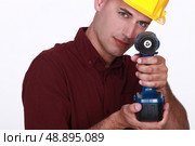 Carpenter using cordless. Стоковое фото, агентство Ingram Publishing / Фотобанк Лори
