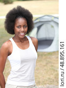 Woman in front of her tent. Стоковое фото, агентство Ingram Publishing / Фотобанк Лори