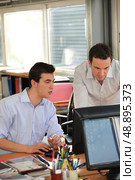 twosome of male employees in office. Стоковое фото, агентство Ingram Publishing / Фотобанк Лори