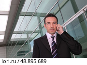 low angle shot of executive outside office. Стоковое фото, агентство Ingram Publishing / Фотобанк Лори