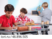 Pupils in class. Стоковое фото, агентство Ingram Publishing / Фотобанк Лори