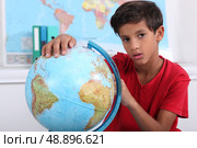 Pupil with globe. Стоковое фото, агентство Ingram Publishing / Фотобанк Лори