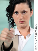 Close-up shot of a woman pointing her pen. Стоковое фото, агентство Ingram Publishing / Фотобанк Лори
