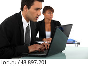 Business couple in meeting. Стоковое фото, агентство Ingram Publishing / Фотобанк Лори