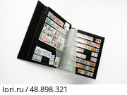 Stamp album. Стоковое фото, агентство Ingram Publishing / Фотобанк Лори