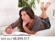 Woman writing in her diary. Стоковое фото, агентство Ingram Publishing / Фотобанк Лори