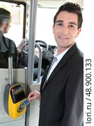 Commuter swiping his tram ticket. Стоковое фото, агентство Ingram Publishing / Фотобанк Лори
