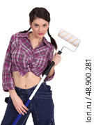 sexy craftswoman painter holding a roller brush. Стоковое фото, агентство Ingram Publishing / Фотобанк Лори